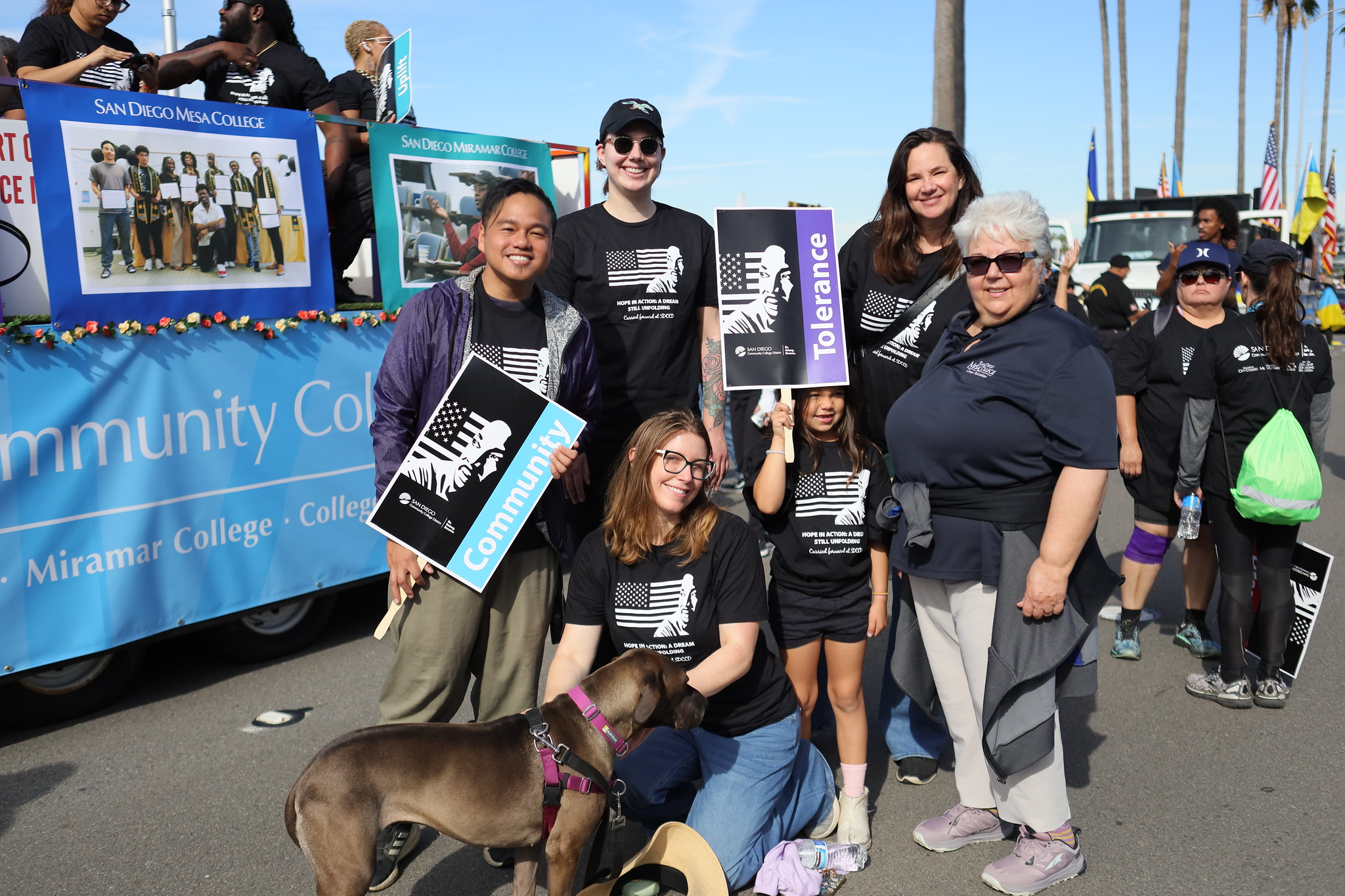Six parade-goers take a group photo.