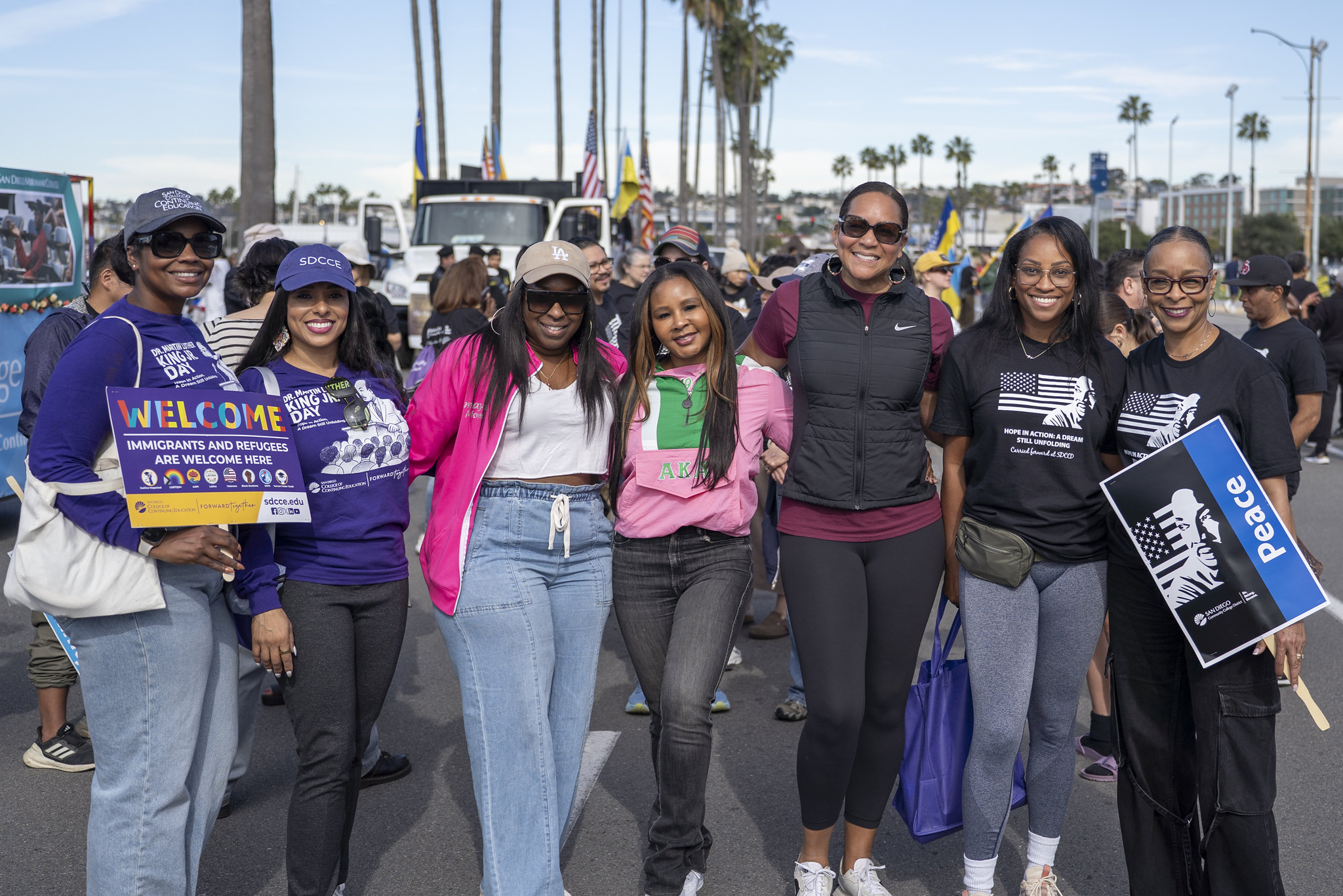Seven parade-goers take a group photo.