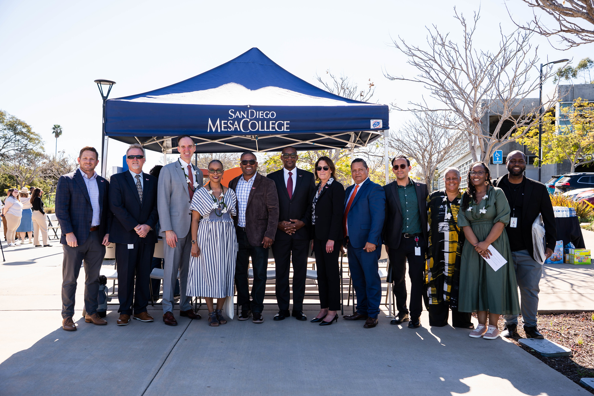
12 District, Mesa, and community leaders take a group photo at the tribute.
