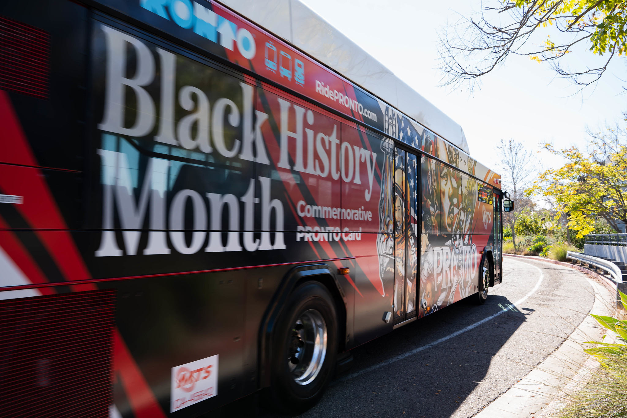 
A bus that has a wrap for Black History Month.
