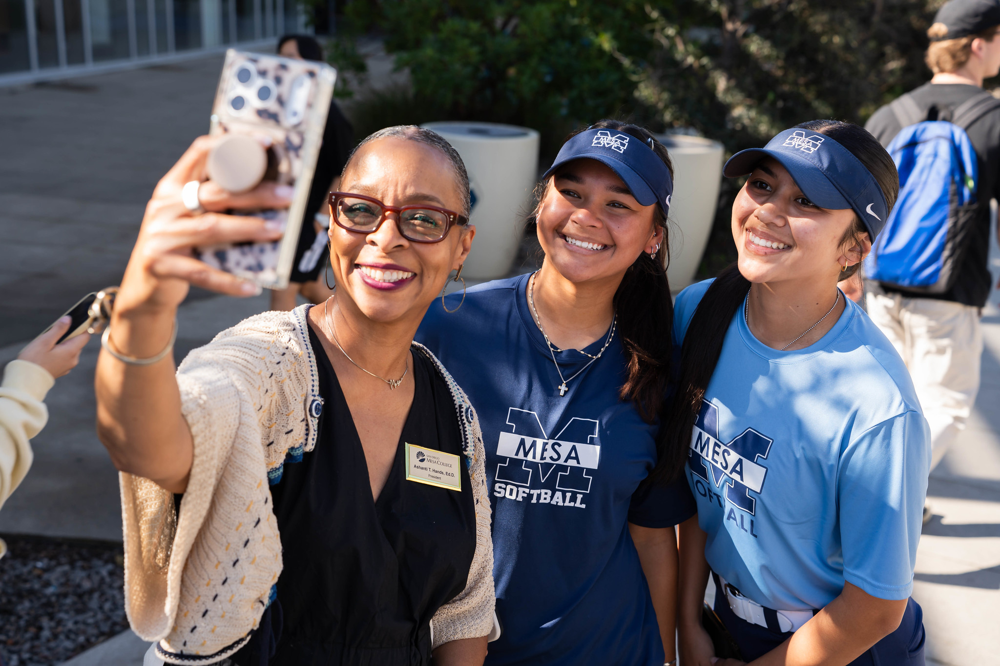 
Mesa College President Ashanti Hands takes a selfie with two students on the women's softball team.
