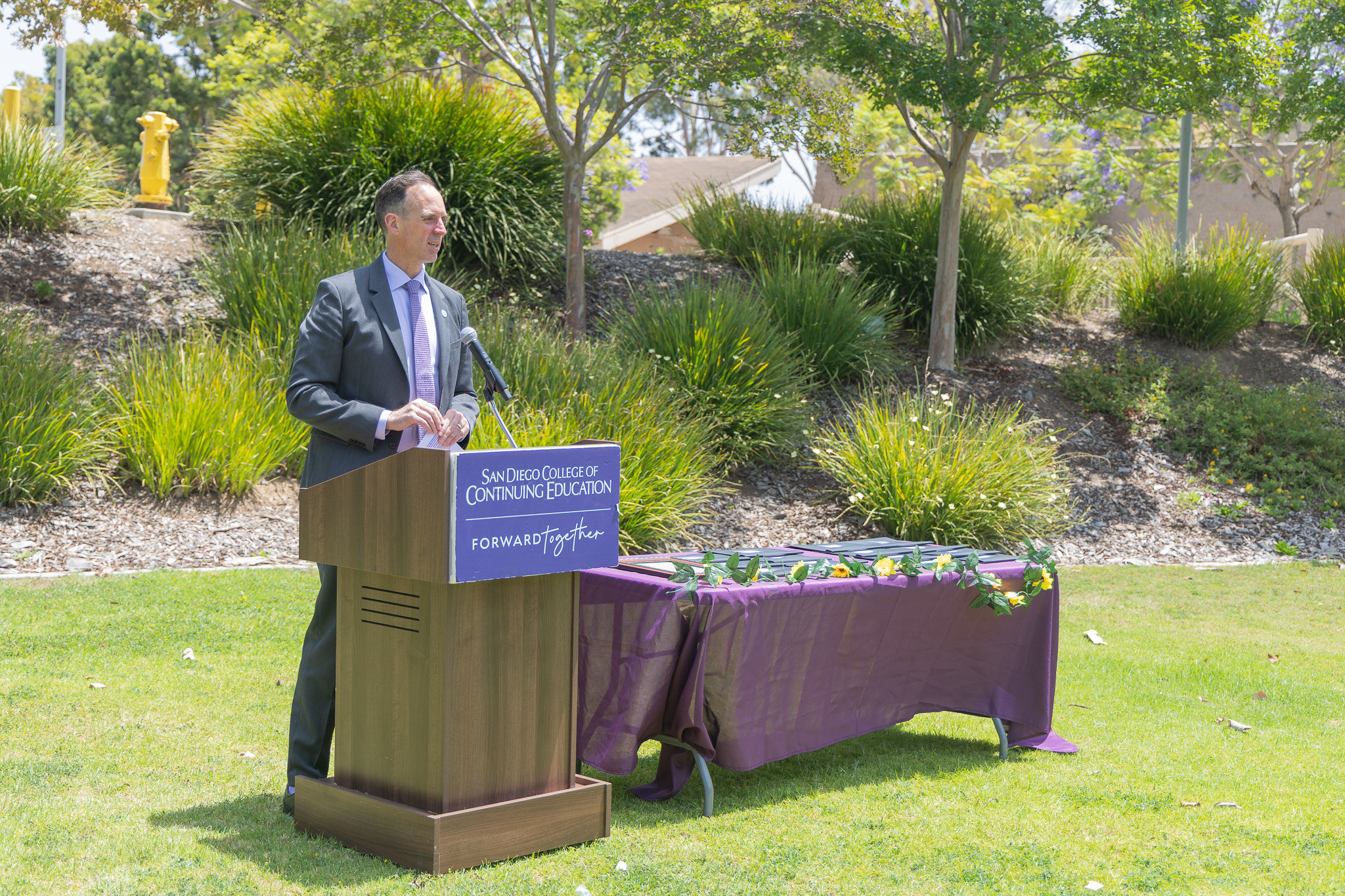 Chancellor Gregory Smith at a podium at College of Continuing Education's event.&nbsp;