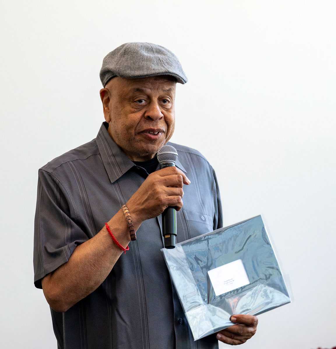 A City College employee receives his service certificate.