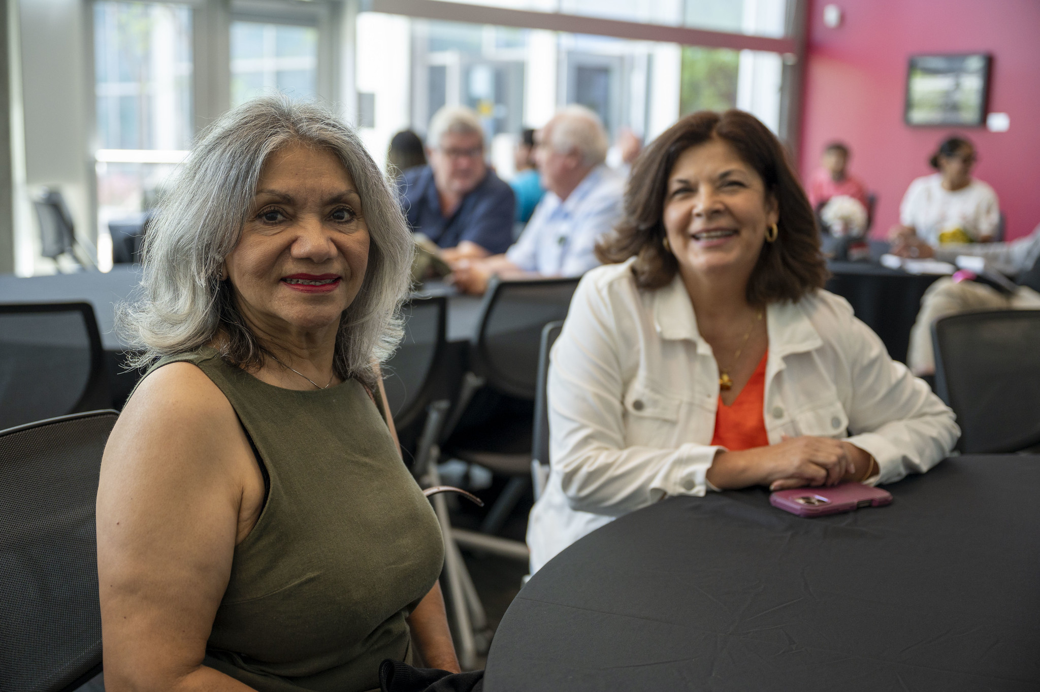 Two employees at City College's event.&nbsp;