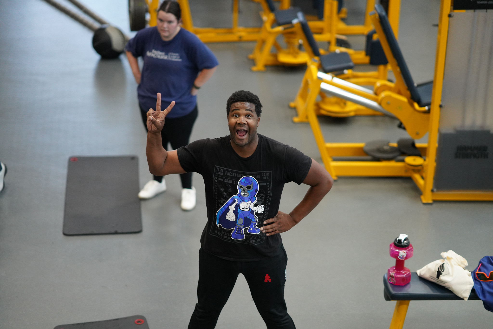 A man in Mesa's gym giving a peace sign.&nbsp;