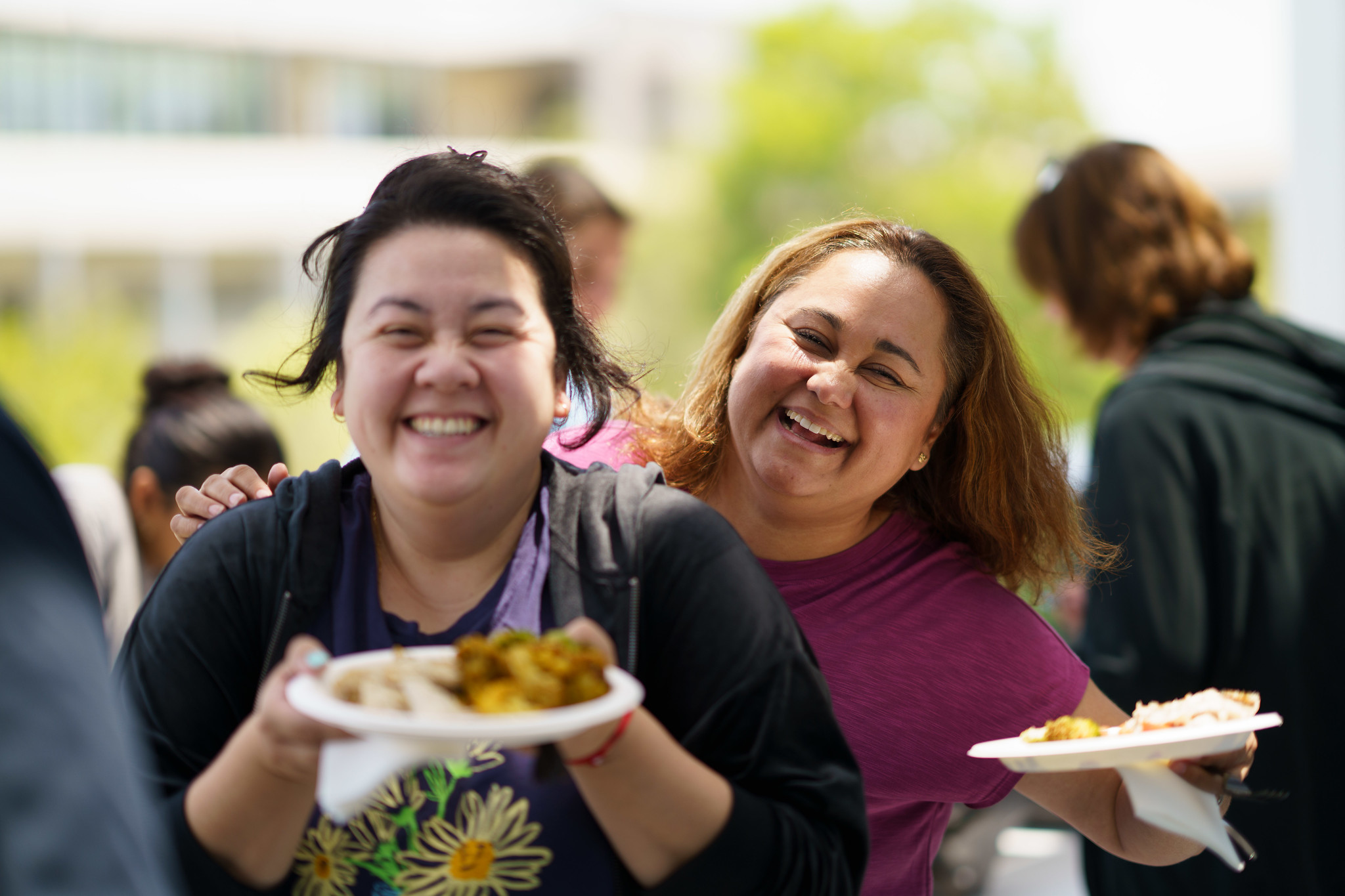 Two employees with their lunch at the Mesa event.&nbsp;