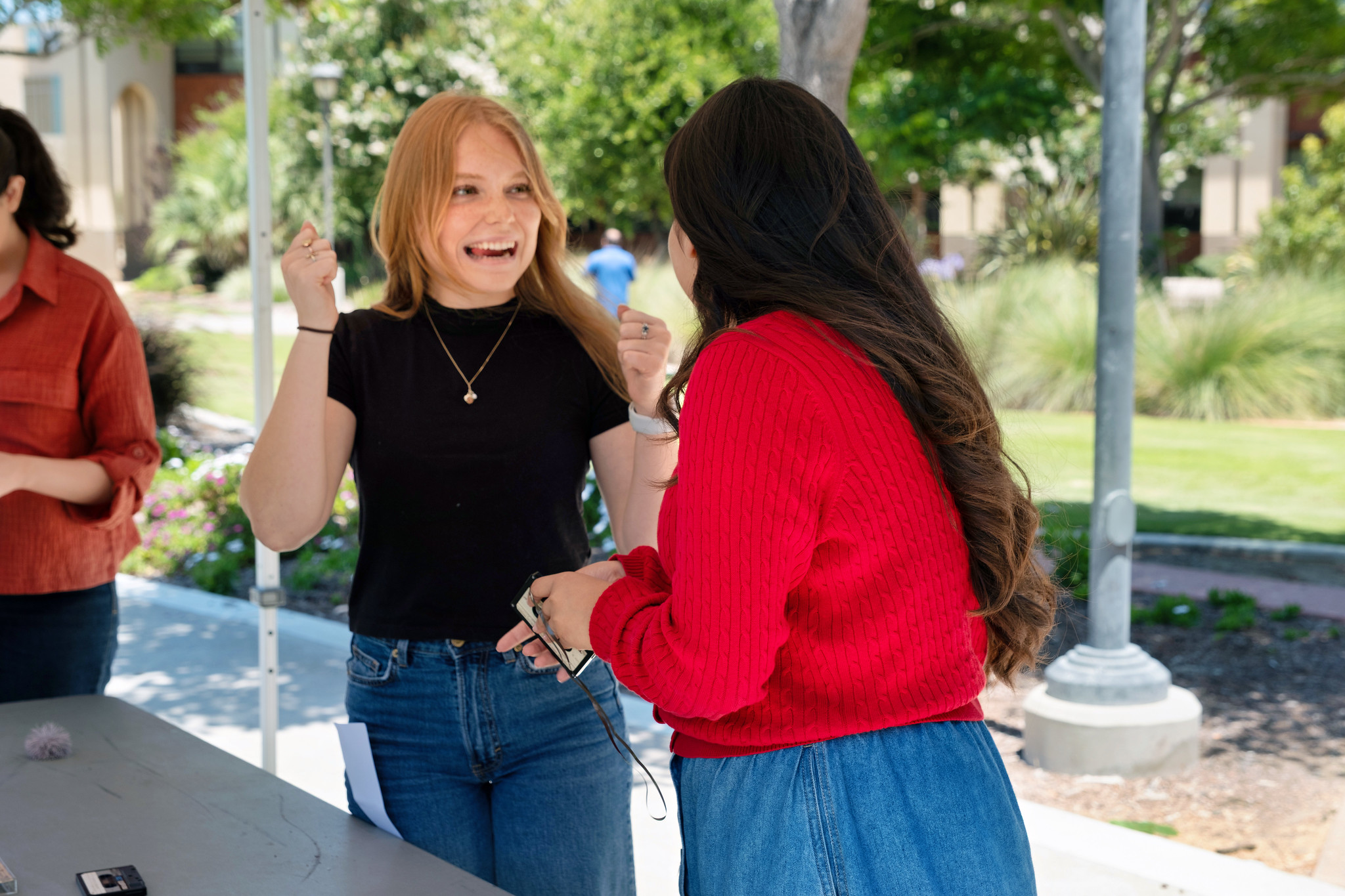 Two Miramar employees at table playing a game.&nbsp;