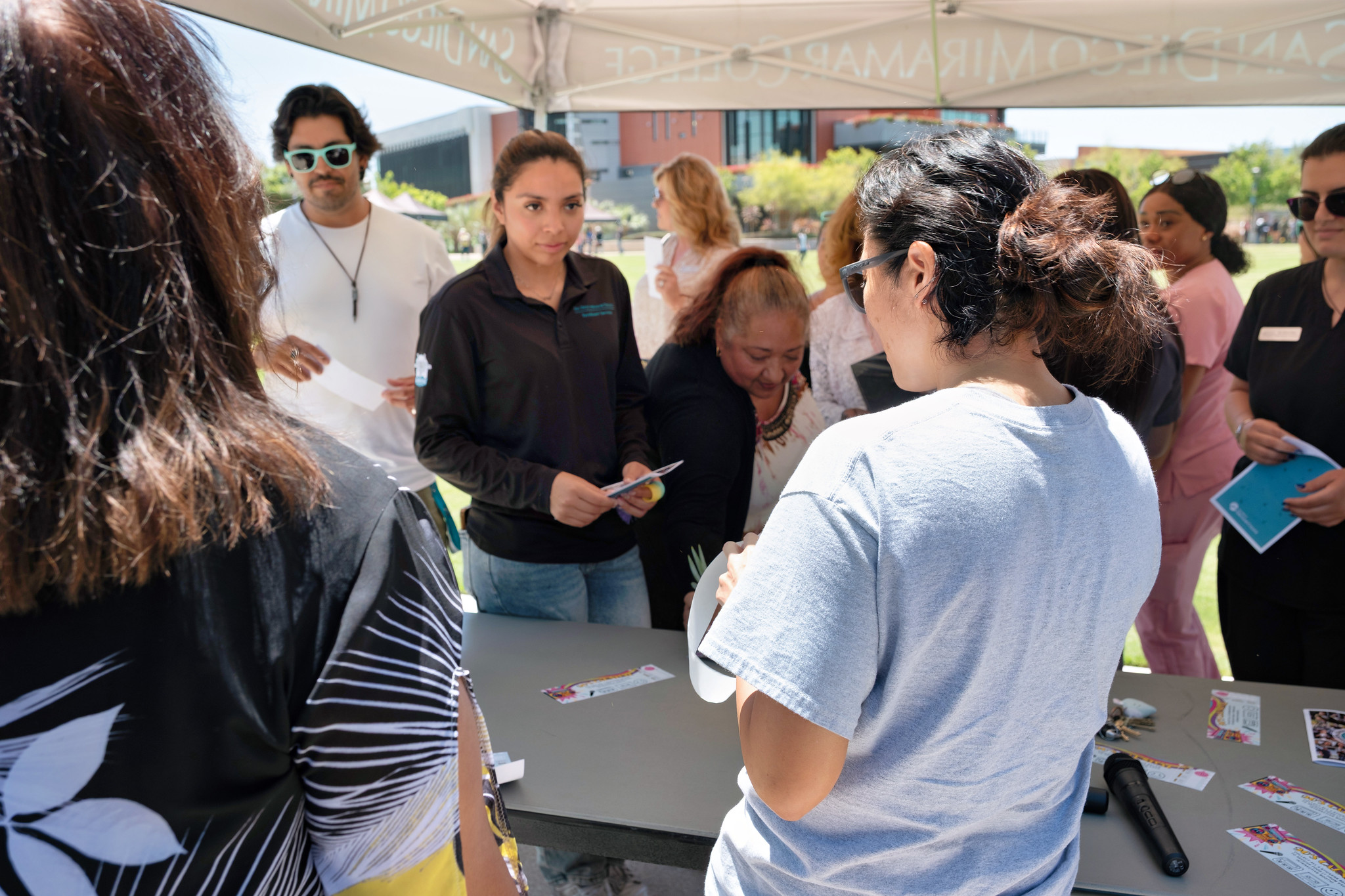 A group of people at an outdoor table at Miramar's event.&nbsp;