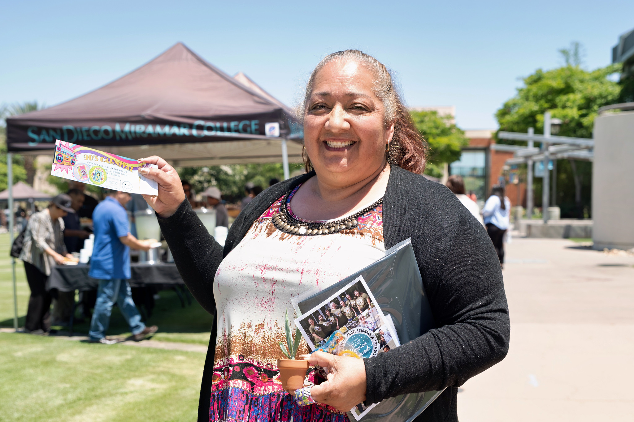 A lady holds up a ticket at Miramar's event.&nbsp;